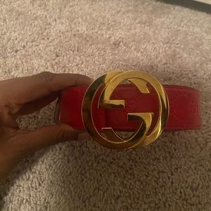 Red Embossed Gucci belt with gold buckle